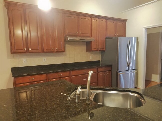 Building Photo - Beautiful transitional 4 bedroom brick rancher on quiet street just off of Hull Street/Genito Roa...