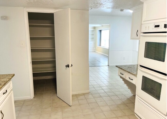 Kitchen pantry and 1 of 2 dining rooms - 15231 Highsprings Dr