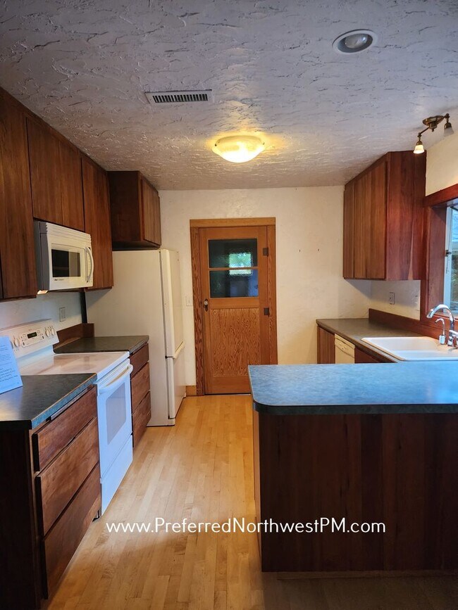 Building Photo - Beautiful home on 2 organically-landscape ...