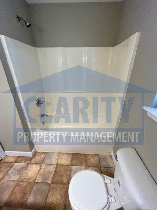 Building Photo - Charming three-bedroom home with carport!