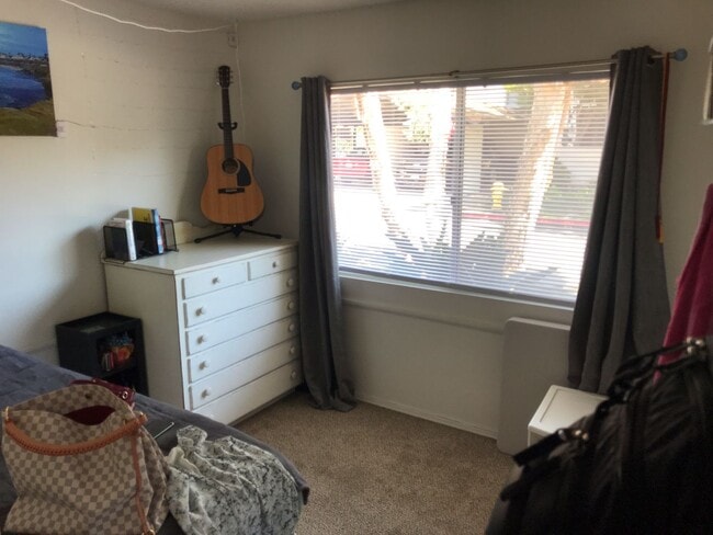 Building Photo - Beautiful Townhome with large fenced back patio, second story balcony, and two covered parking spots