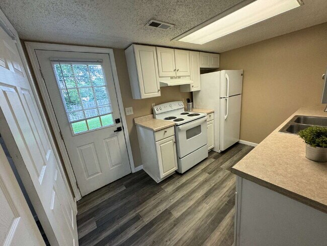 Building Photo - Love Grows — Spacious 2-Story Townhome