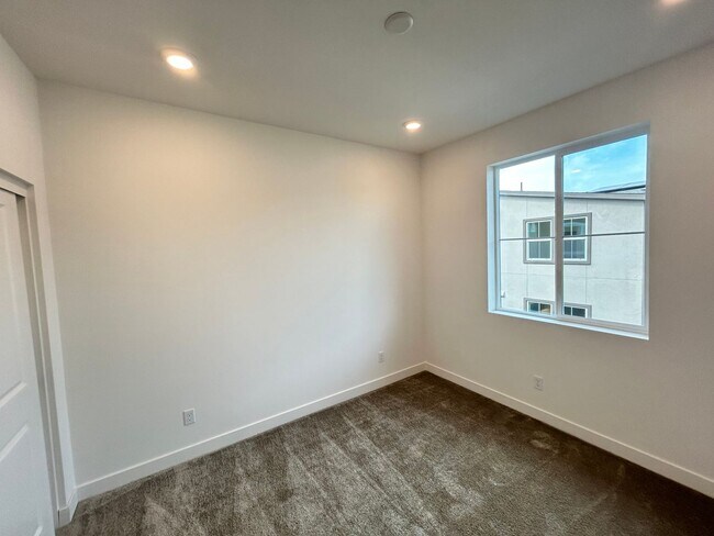 Building Photo - Gorgeous, 3 level townhome, featuring 2 car garage central Air, and in Unit laundry.
