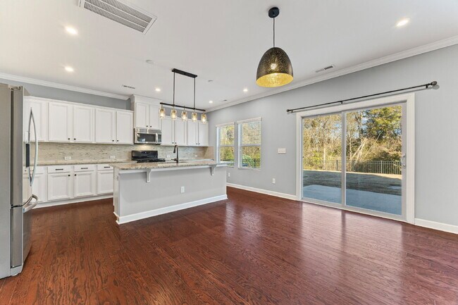 Building Photo - Classic finishes paired with an open, versatile layout!