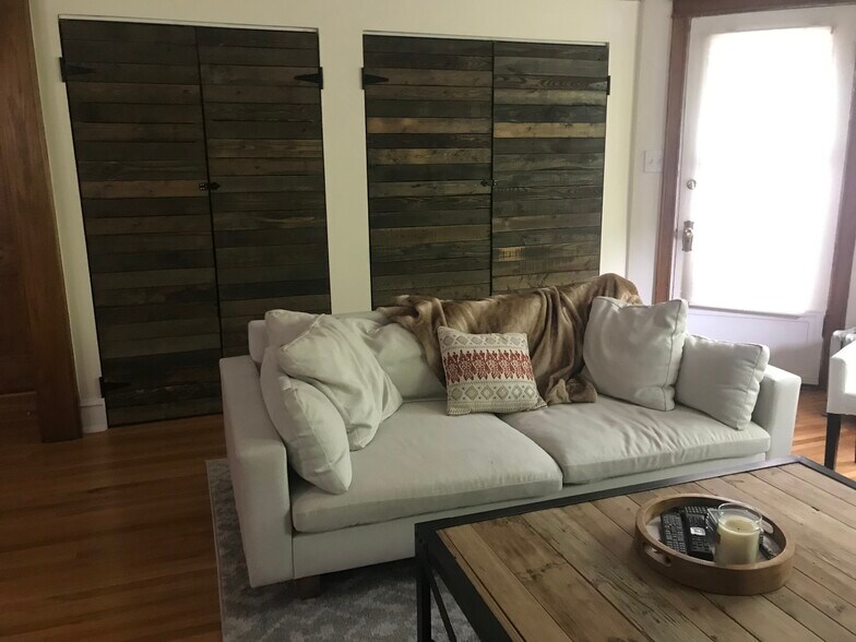 Giant closets with custom reclaimed wood doors - 3654 N Janssen Ave