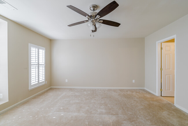 Spacious master bedroom with two large closets (one walk in closet) ceiling fan with remote, large windows with plantation shutters and flat screen HD TV included with rental. - 22785 Settlers Trail Terrace