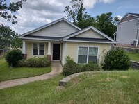 Building Photo - Great three bedroom two bath home Close to...