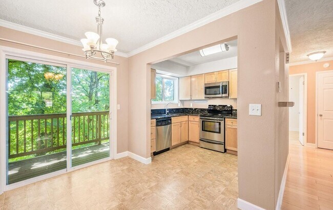 Building Photo - Spacious 2-Bedroom Condo with Forest Views, Private Balcony, In-Unit Laundry & Community Amenitie...