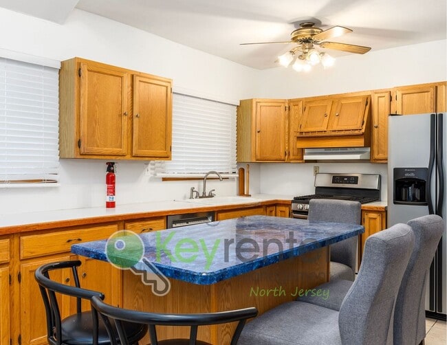 Building Photo - Spacious 2BR / 2.5BA Home with Huge Deck, Private Yard & Parking for 6