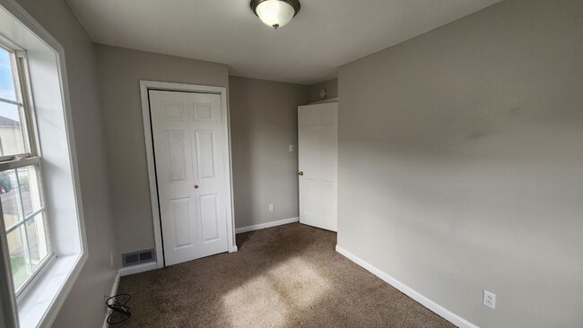 Building Photo - Corner 1st and 2nd flr. unit with central ...