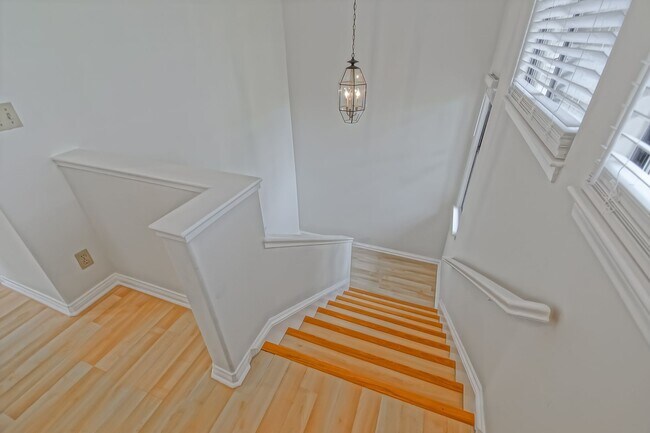 Building Photo - PRIME POOLFRONT LOCATION & CLOSE TO MAIN GATE! BRIGHT & SPACIOUS, END-UNIT POOLFRONT TOWNHOUSE W/...