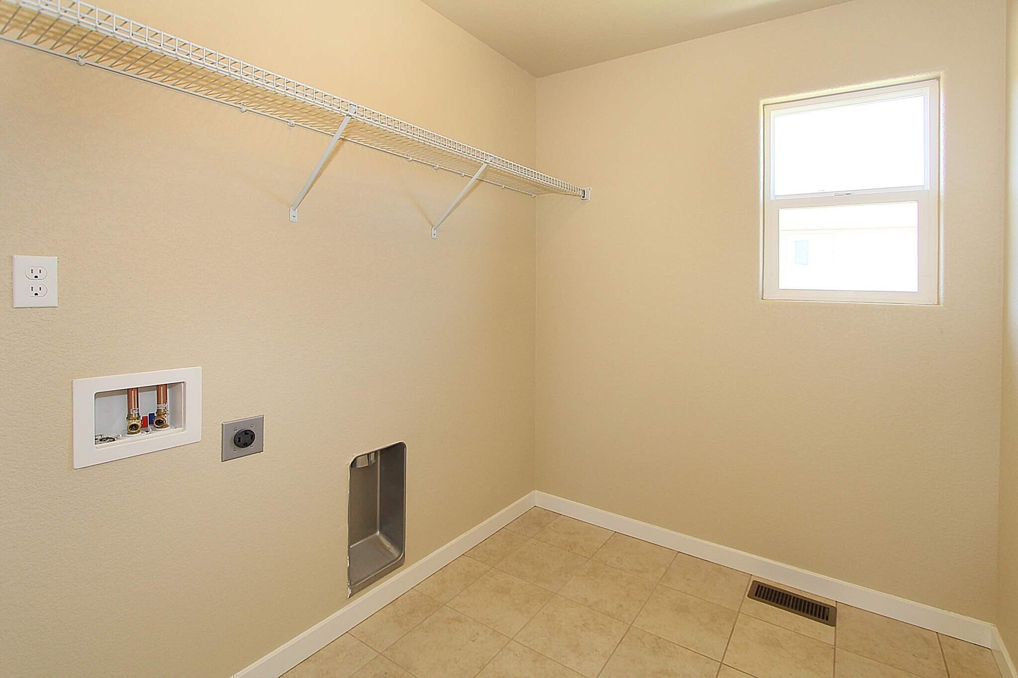 Upstairs laundry room - 7766 Wagonwood Place