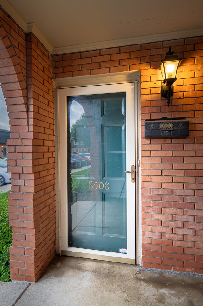 Private covered entry and double doors - 8508 Canterbury Sq E