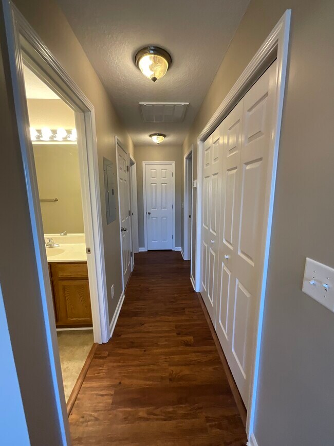 Hallway with Linen Closet at the end. - 1925 Levy Dr