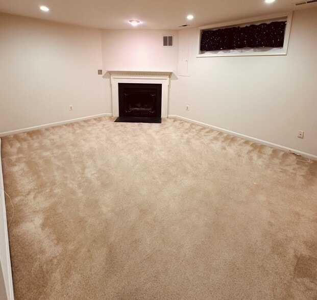 Family room with wood burning fireplace - 397 S Pickett St