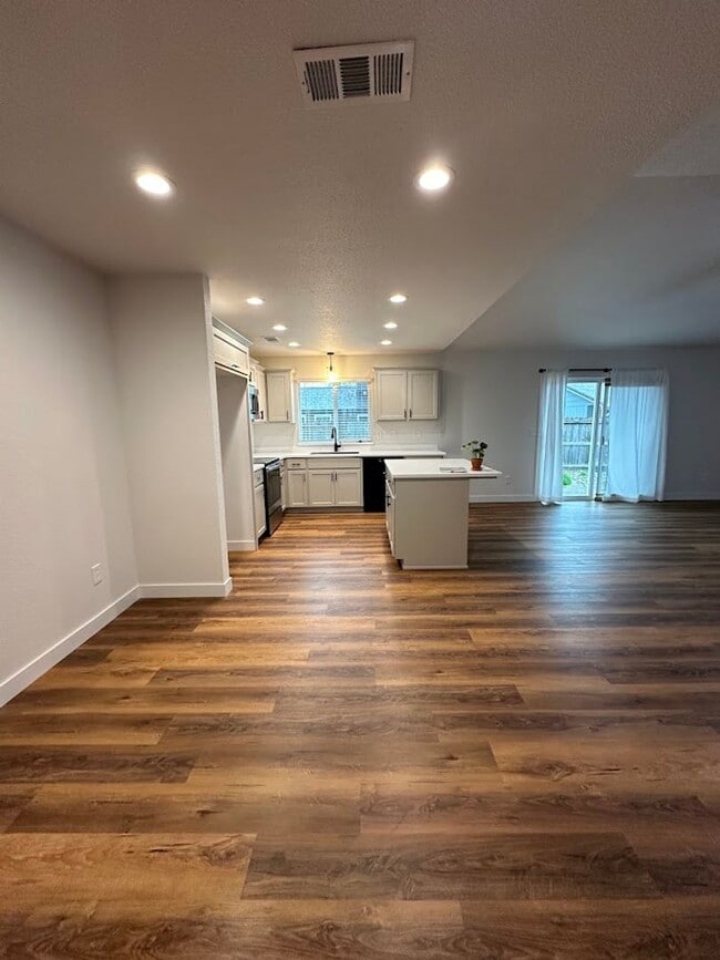 Building Photo - Updated Home with Island Kitchen, LVP Flooring, and Yard Care Included!