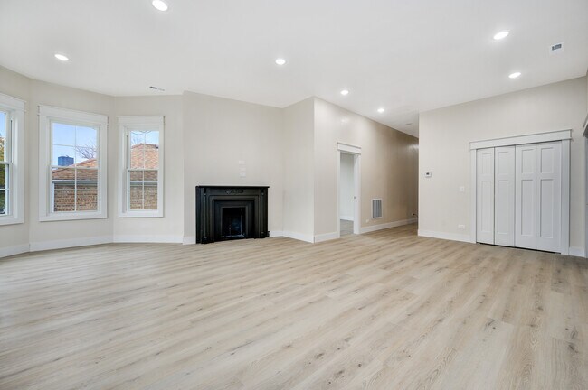 Living room, dining room. - 1619 W Balmoral Ave