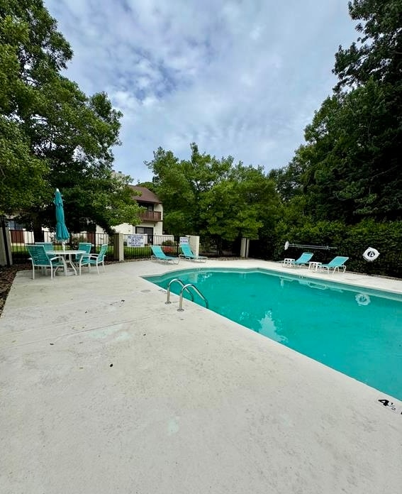 Pool steps away from back patio. - 10027 Washington Cir