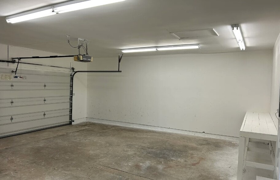 Oversized attached fully insulated 2 car garage with new lighting - 2751 Hart Rd
