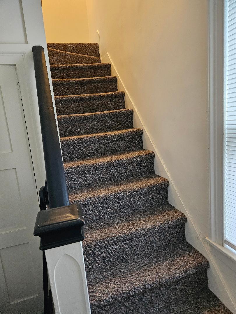 Stairway from foyer to apartment - 16 Oak St