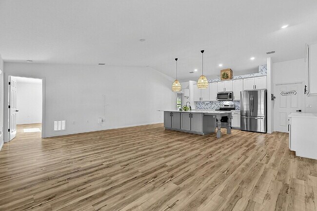 Building Photo - Modern 4-Bedroom, 3-Bath Home with Private In-Law Suite – Palm Coast, FL