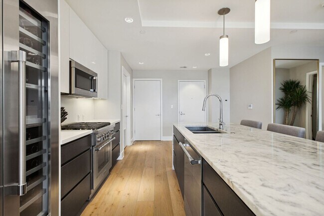 Building Photo - Elegant 2BR at The Adora | 1,500+ SF, Chef’s Kitchen & Garage Parking!