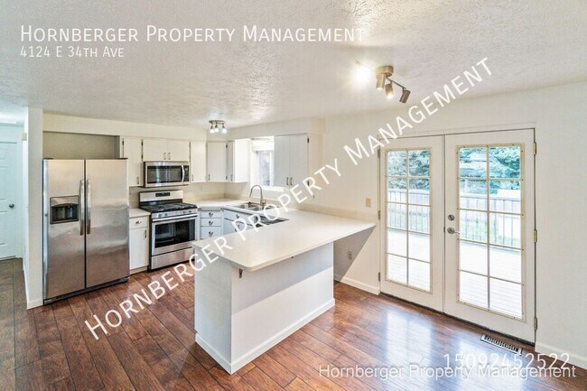 Building Photo - 4124 E 34th Ave