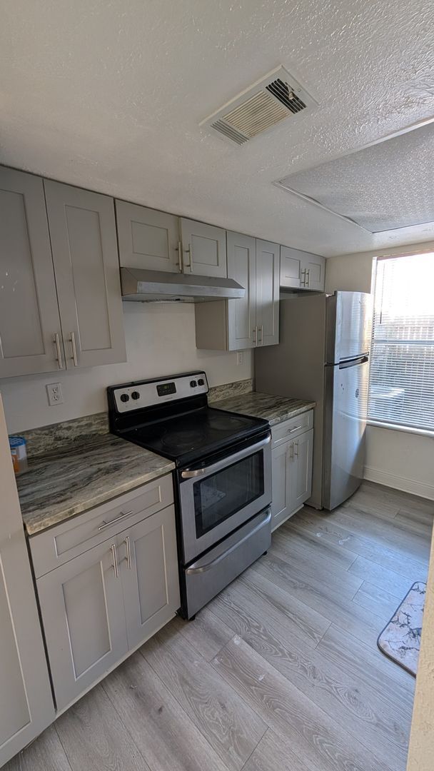 Building Photo - Two Bedrooms with terrace and fenced patio. Move in Special: Move before January 1sth for a secur...