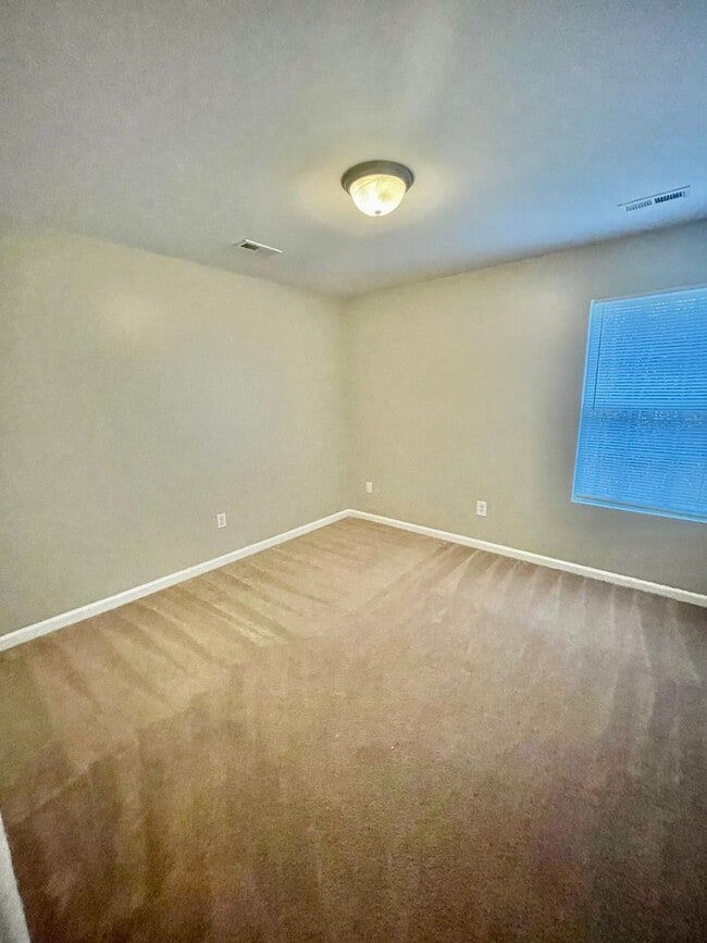 Building Photo - This two-story, 4-bedroom, 2-bath duplex in Fort Mill, SC sits on a corner lot