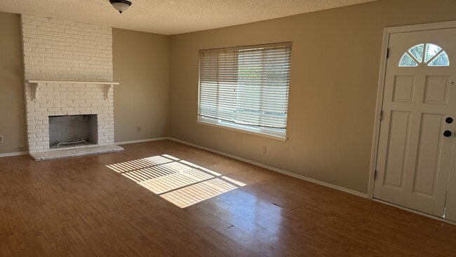 Living Room with fireplace - 8801 Lauder Cir