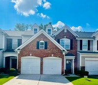 Outside view of the townhouse with 2 car garage. - 8321 Deckbar Pl