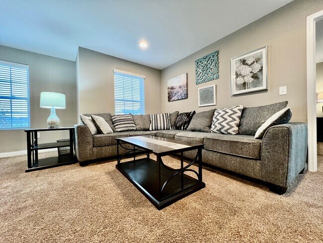 Building Photo - Executive corporate rental features community pool. Fully furnished and includes all utilities.