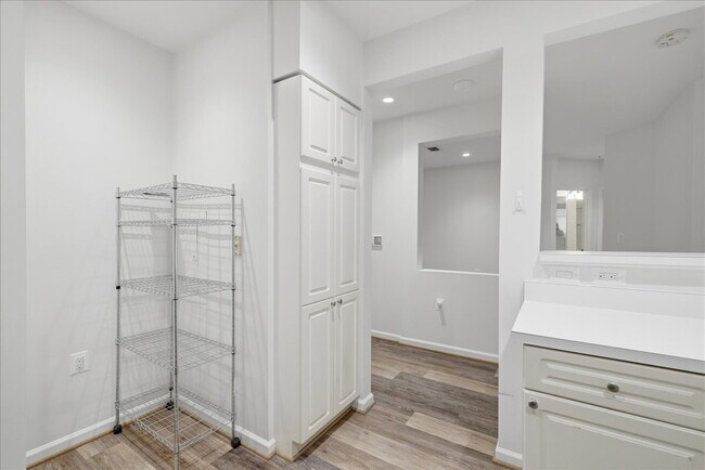 Building Photo - Commuter’s Paradise! Ground-Level 2BR Condo  Welcome home to this stunning, sun-filled 2-bedroom ...