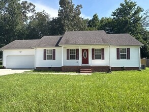 Building Photo - Charming Home with Covered Back Deck and Fenced in Yard...