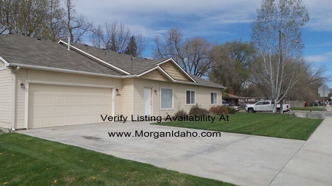 Primary Photo - 2-car garage, mowing included, convenientl...