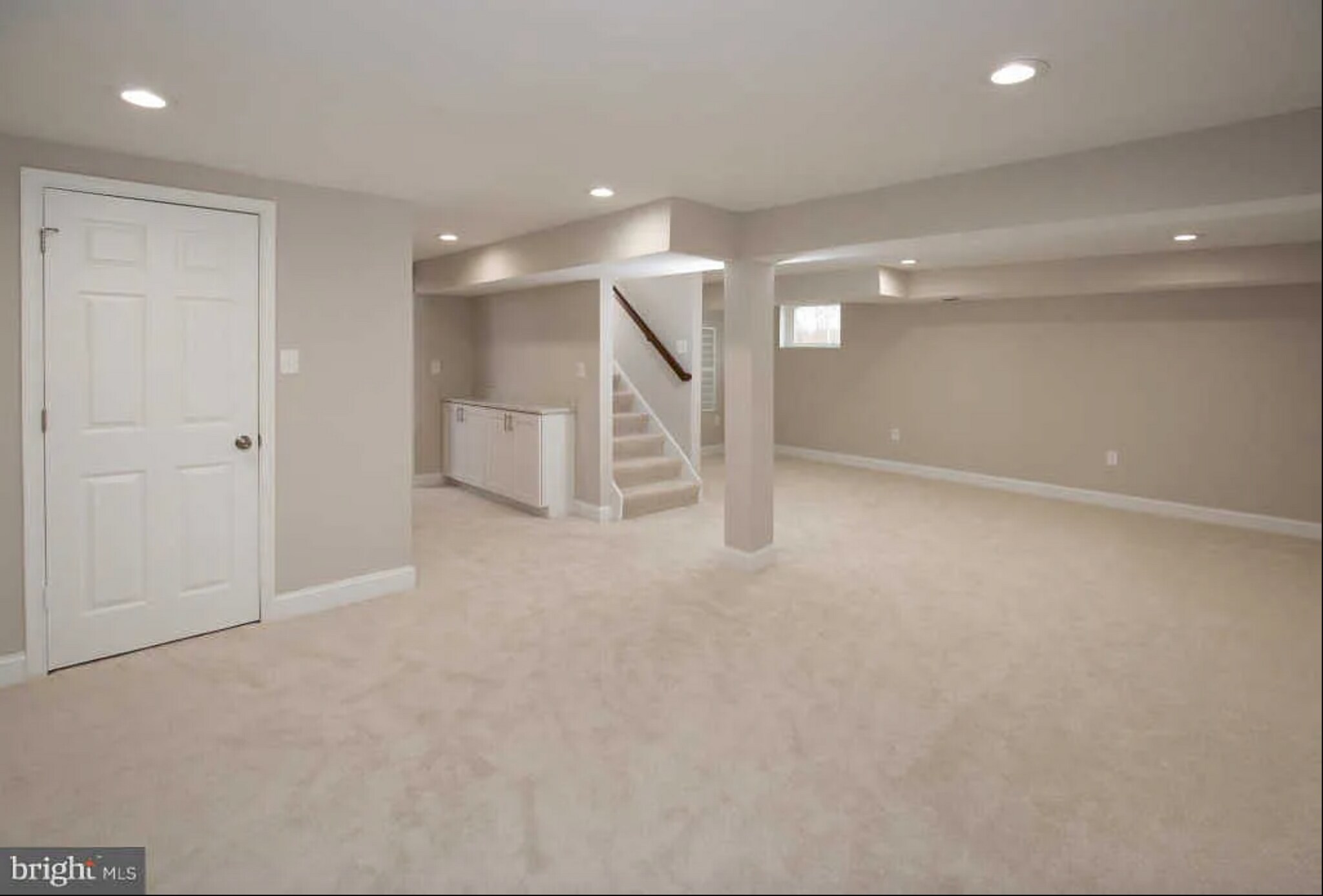 Downstairs space facing stairs - 127 S Jordan St