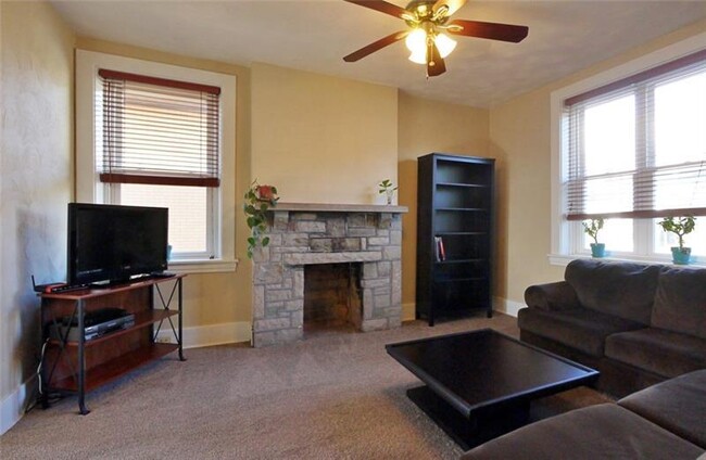 The family room is huge, with even more natural light and a decorative fireplace. - 1109 Haslage Ave