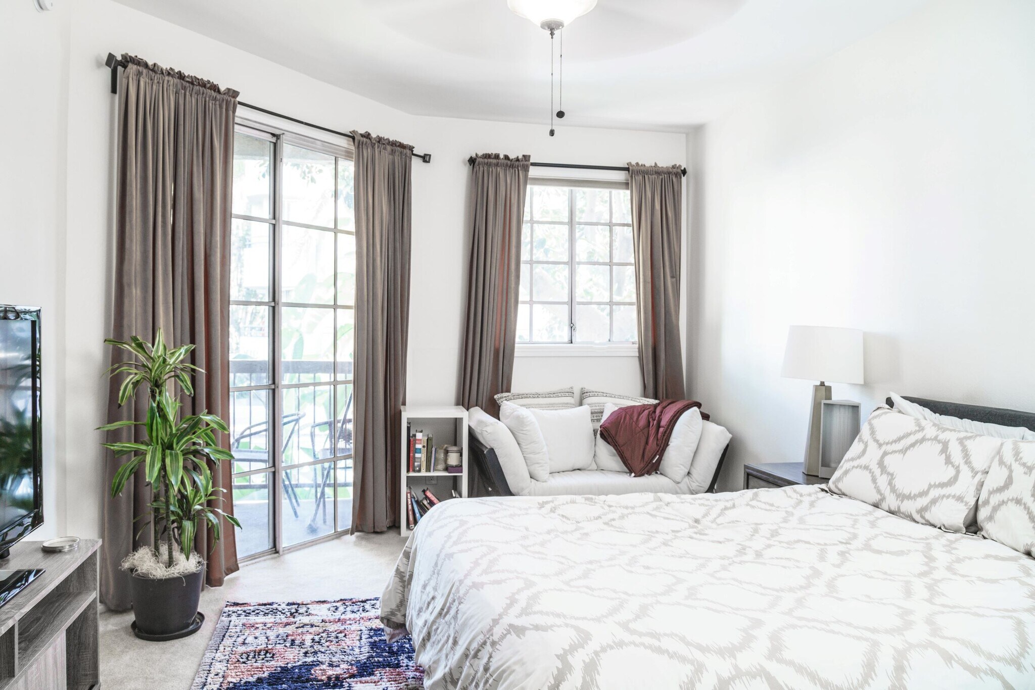 Bedroom 1 with overhead fan and balcony access - 10021 Tabor Street