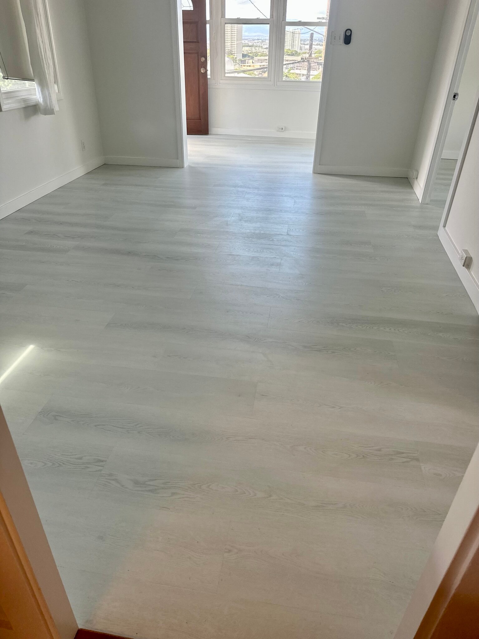 New 8mm luxury vinyl plank (LVP) flooring installed. - 1769 Puowaina Dr