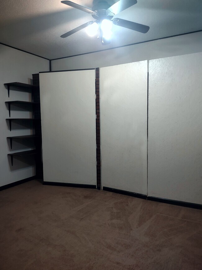 Enclosed garage with more shelves and storage closets - 120 Arrow Lands Trl
