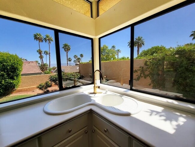 Kitchen corner sink faces mountain views - 72836 Mesa View Dr