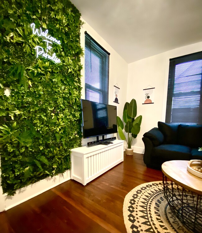 Living room with selfie turf wall - 1309 Bangs Ave