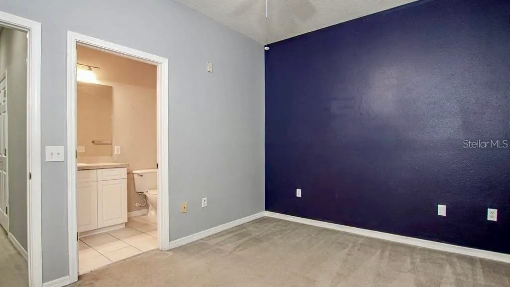 2nd bedroom both repainted, purple is now a sky blue and new carpet (2023) - 5313 Terraza Ct