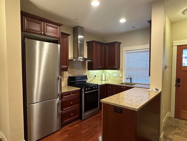 Building Photo - Stunning Tri-Level Condo with Open Concept Layout, Loft, and Private Patio!