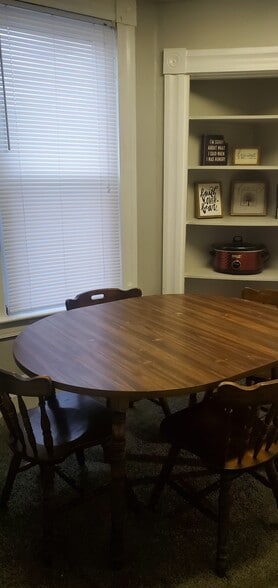 Separate space for kitchen table with built-in corner shelf unit - 127 1/2 S 7th St