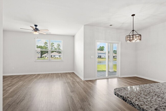 Building Photo - Modern 4BR Home with Screened Porch & Pond Views | Sun Colony, Longs SC