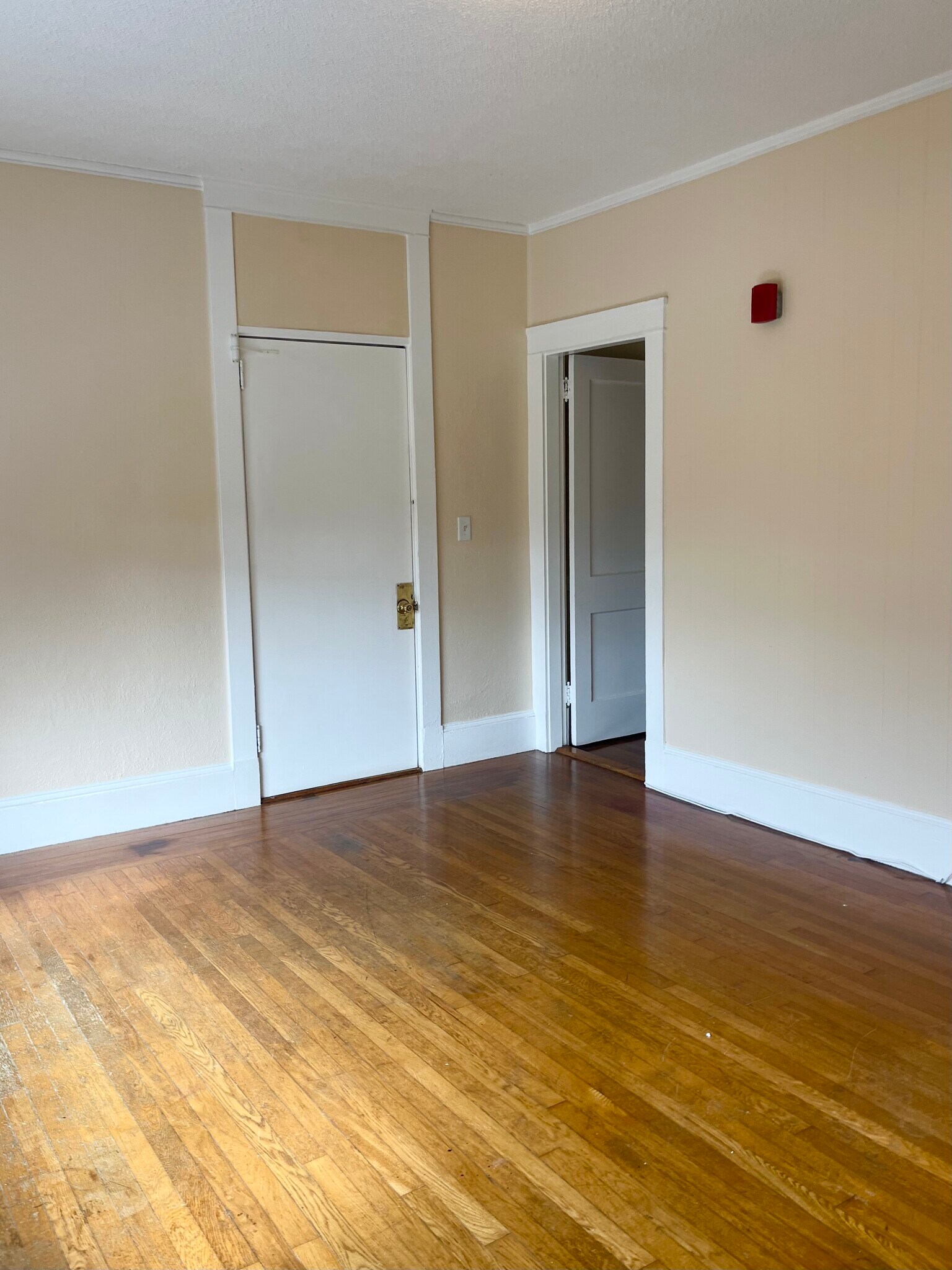 Living room with front entrance and kitchen to the right - 144 Van Zandt Ave
