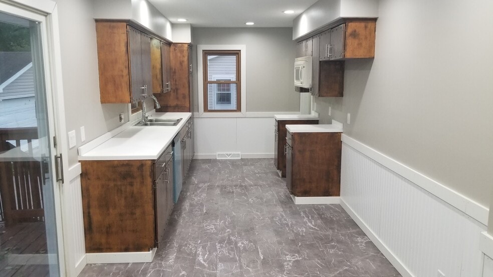 Stainless steel fridgerator, stove, and microwave included. - 719 34th St