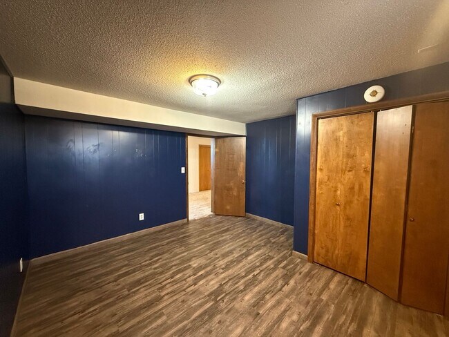 Building Photo - Spacious, four-bedroom, two-bathroom, coun...