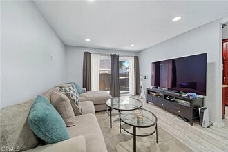 Building Photo - Bright 2-Bed Condo with Central Air, Pool Access & Carport in Anaheim